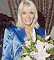 Wendy Richard holding flowers in late 2000