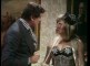 Wendy Richard as cigarette girl, with George Baker, in "Bowler".