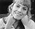 smiling Wendy Richard, face in hands
