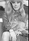 Wendy Richard, circa 1967, in office blouse and skirt, with long blonde wig